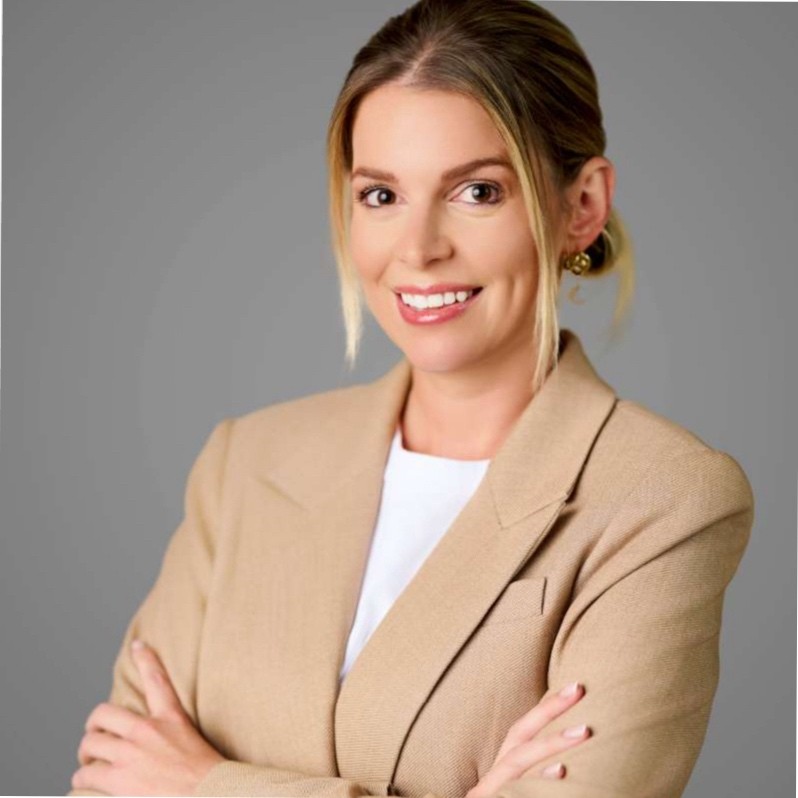 a person in a beige suit