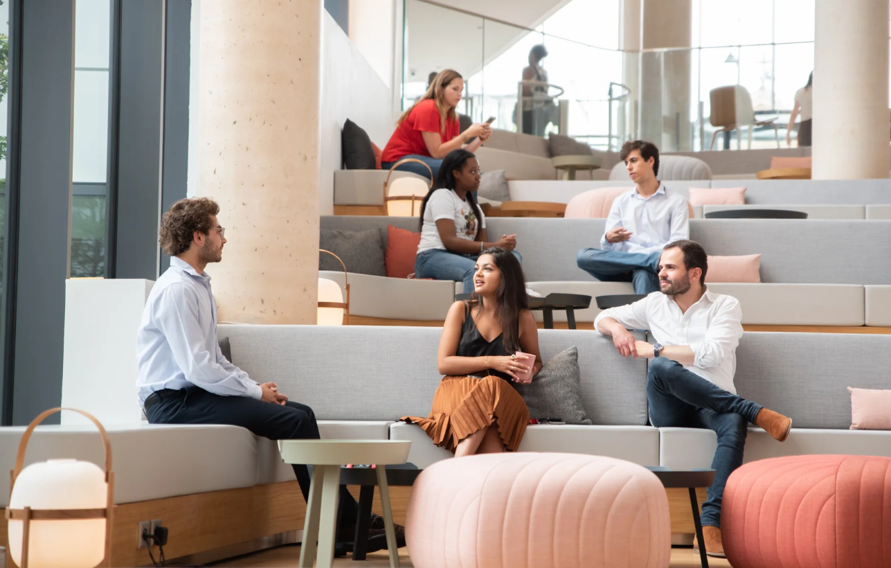 a group of people sitting on couches in a room