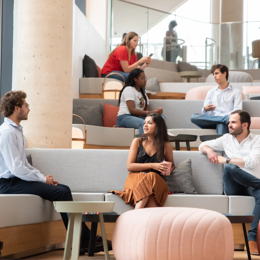 a group of people sitting on couches in a room
