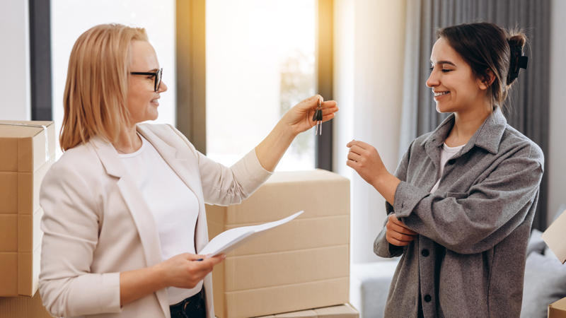 a person holding keys to another person