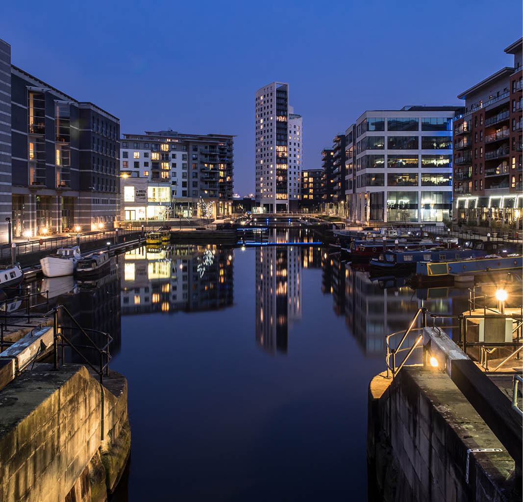 a city with boats and buildings