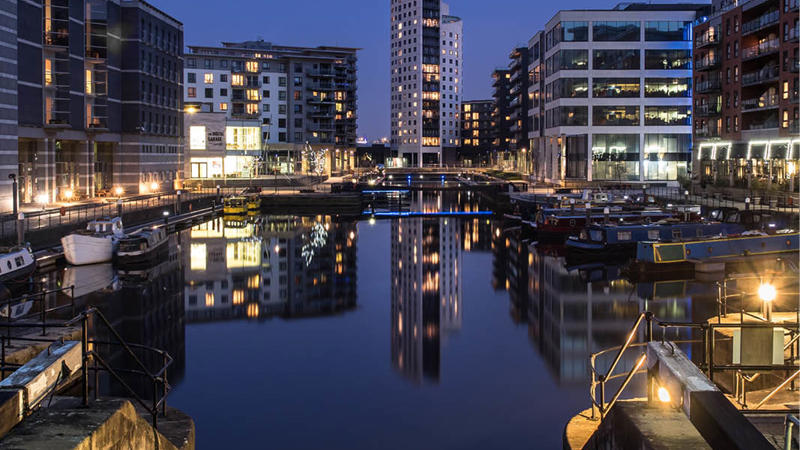 a city with boats and buildings