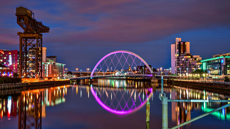 a bridge over a river with lights