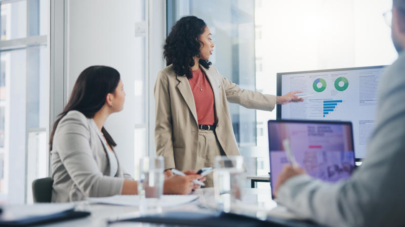 a person pointing at a screen