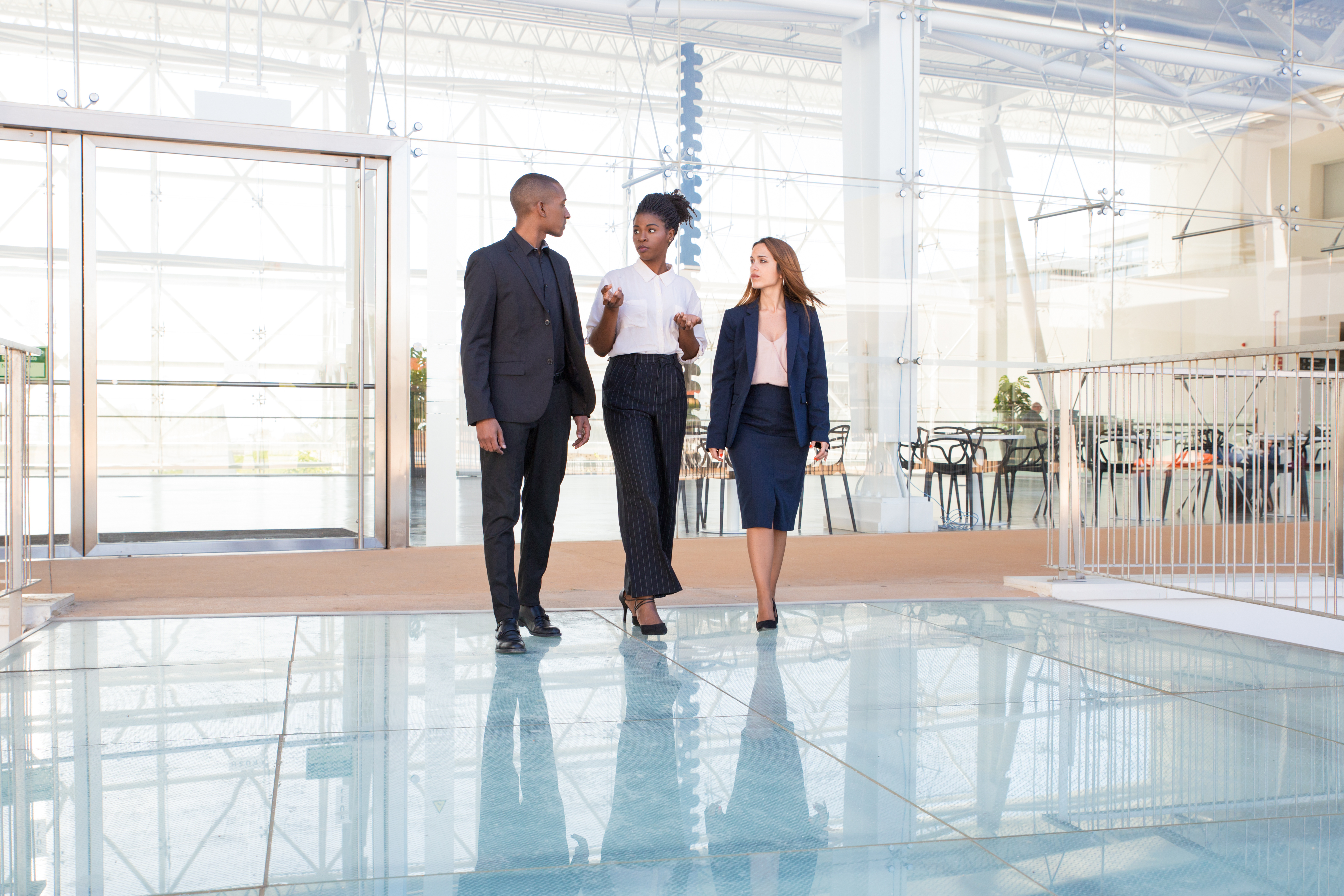 a group of people standing on a glass floor