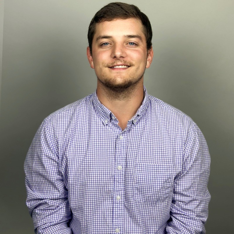 a person in a purple and white checkered shirt