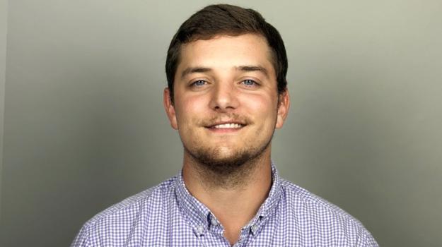 a person in a purple and white checkered shirt