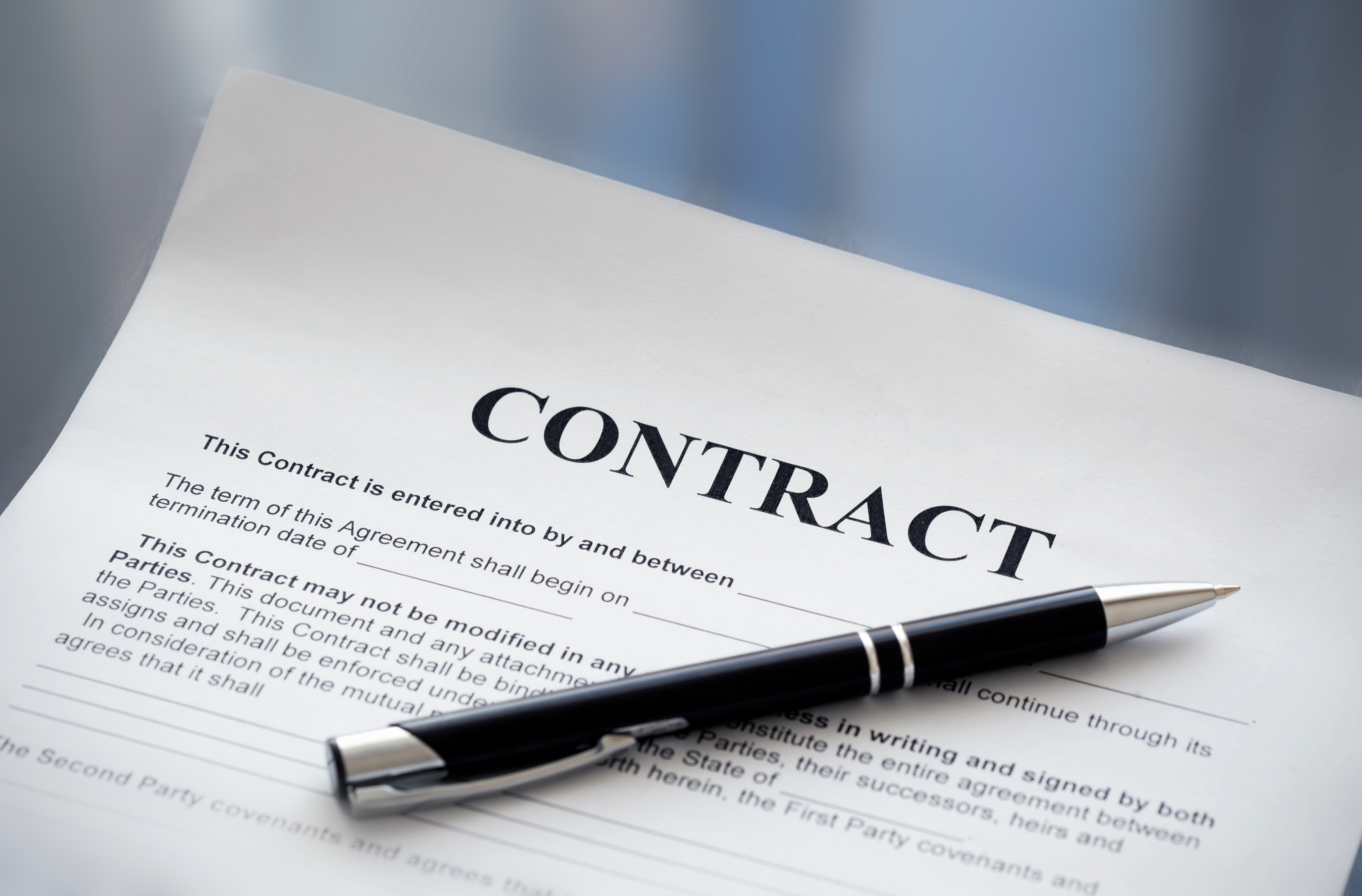a pen on a contract