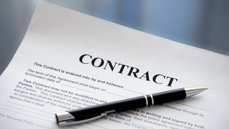 a pen on a contract