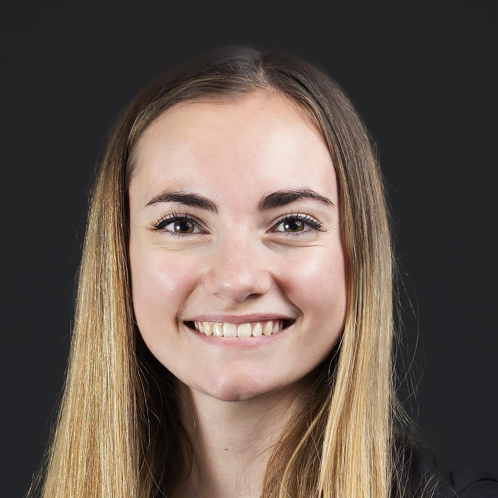 a person smiling at the camera