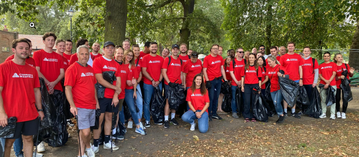 a group of people in red shirts
