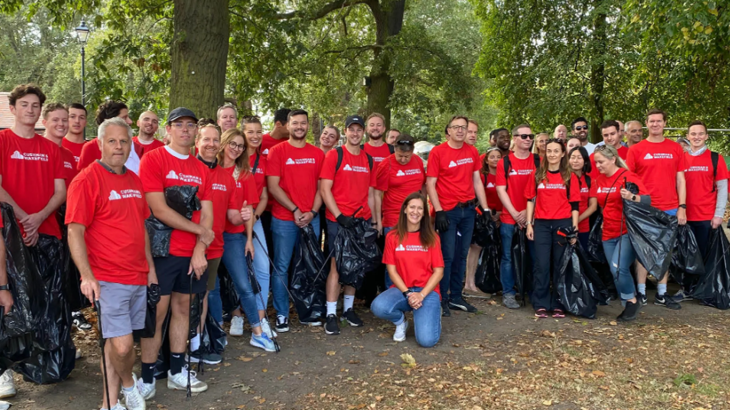 a group of people in red shirts