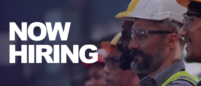 a group of men wearing hard hats