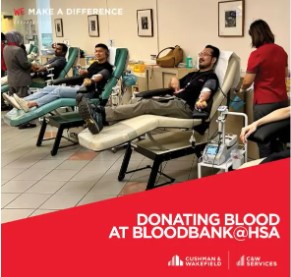 a group of people in a room with chairs