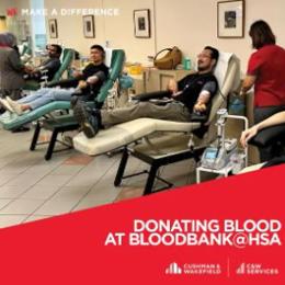 a group of people in a room with chairs