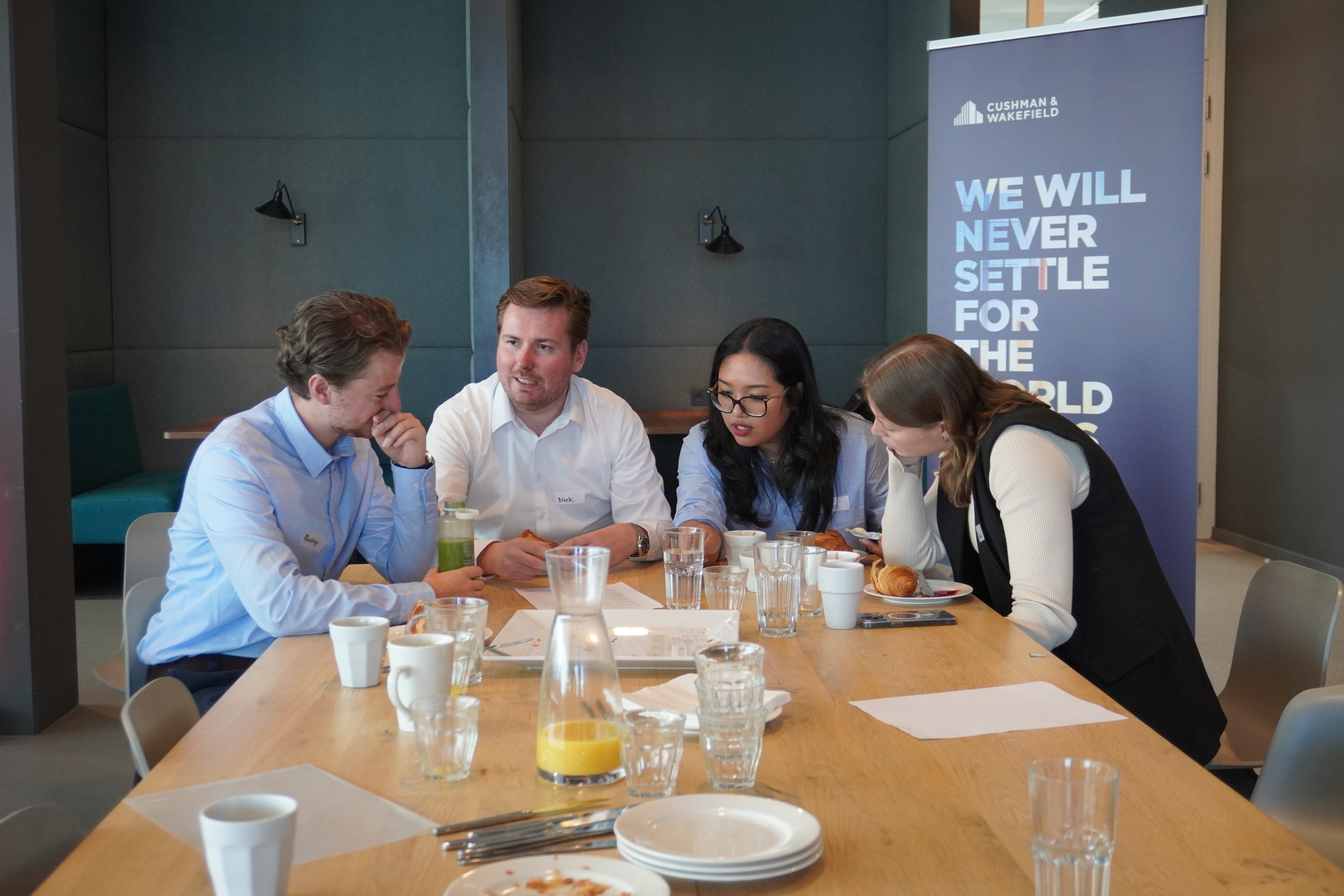 a group of people sitting at a table