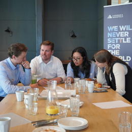 a group of people sitting at a table