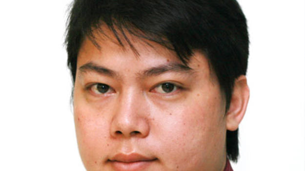 a person in a red shirt and tie