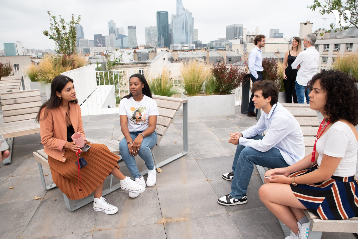 a group of people sitting on a patio