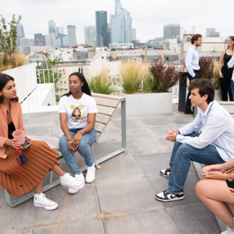 a group of people sitting on a patio