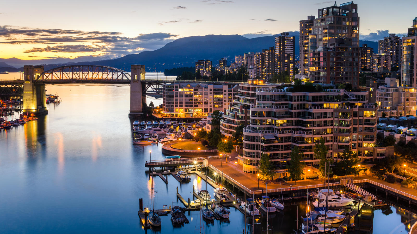 a city with boats and a bridge