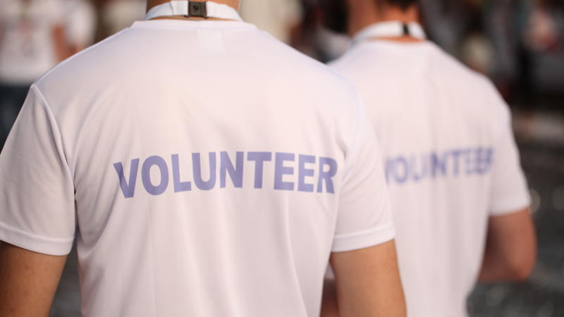 a group of people wearing white shirts