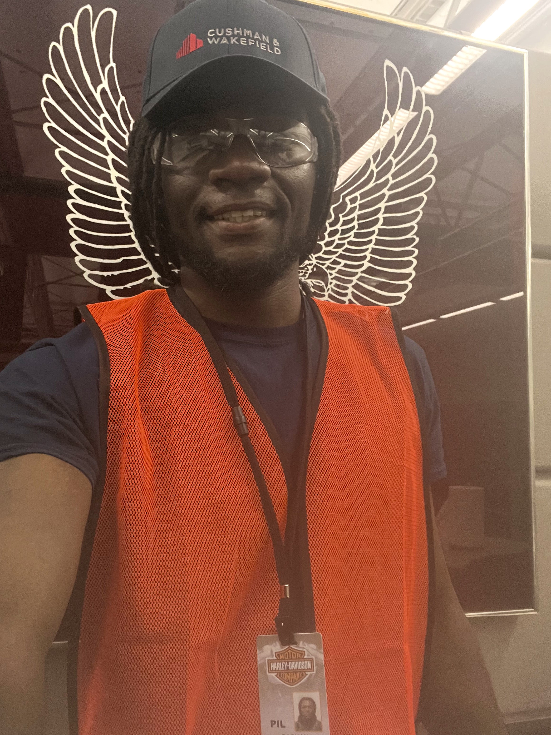 a person wearing a hat and orange vest