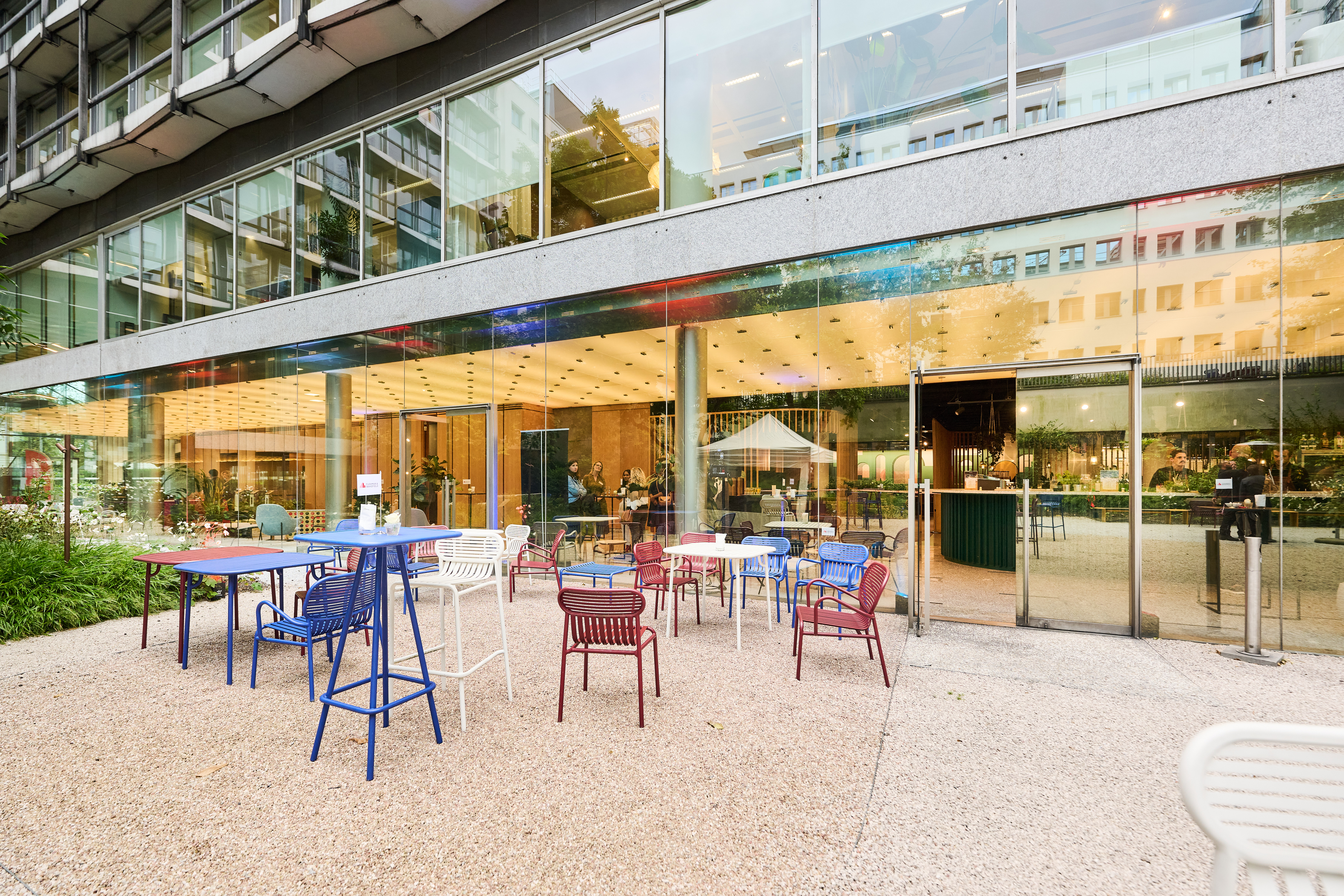 a building with tables and chairs outside