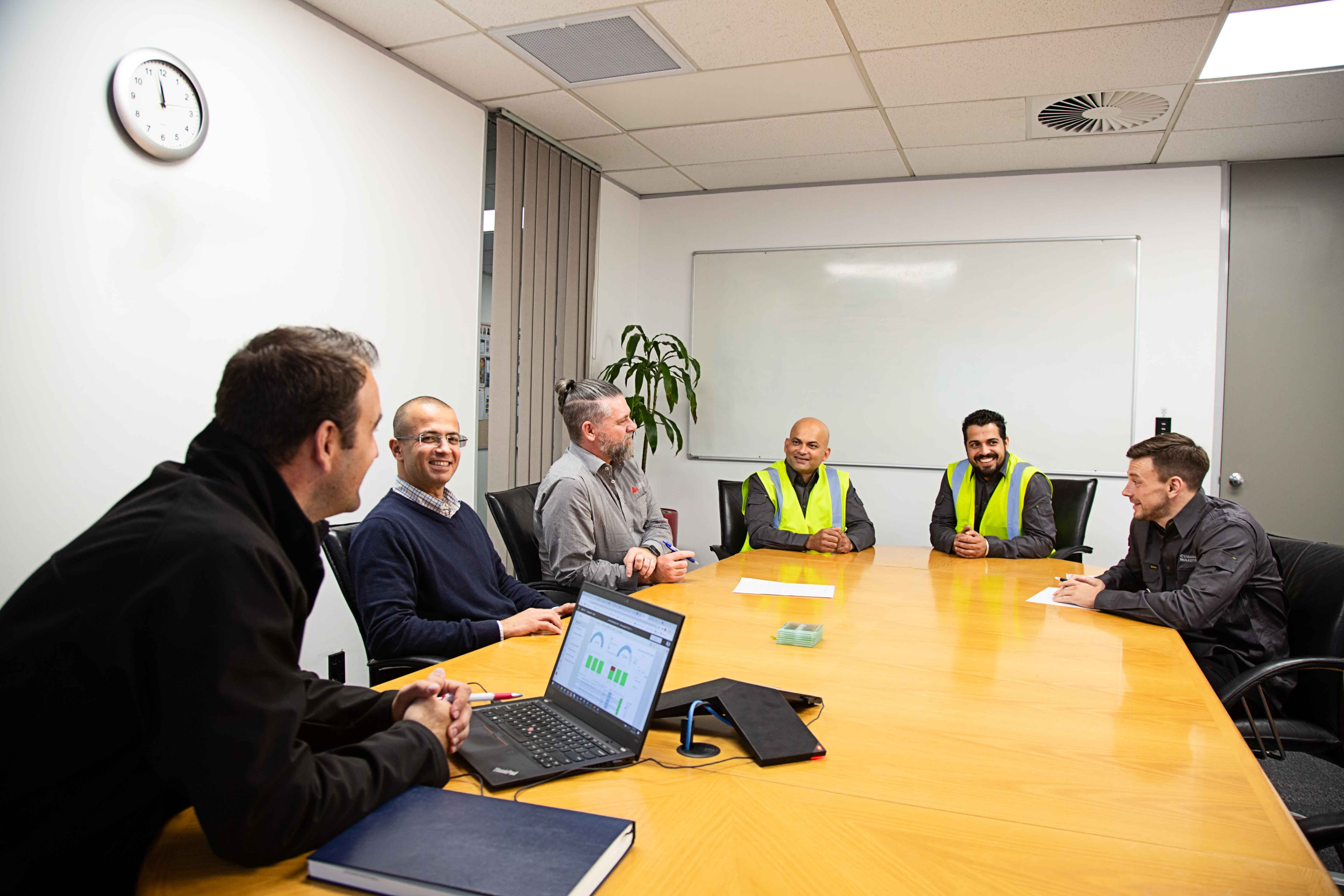 a group of people sitting around a table