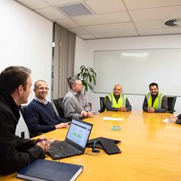 a group of people sitting around a table