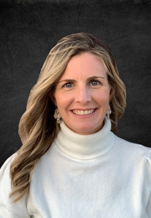 a person in a white turtleneck