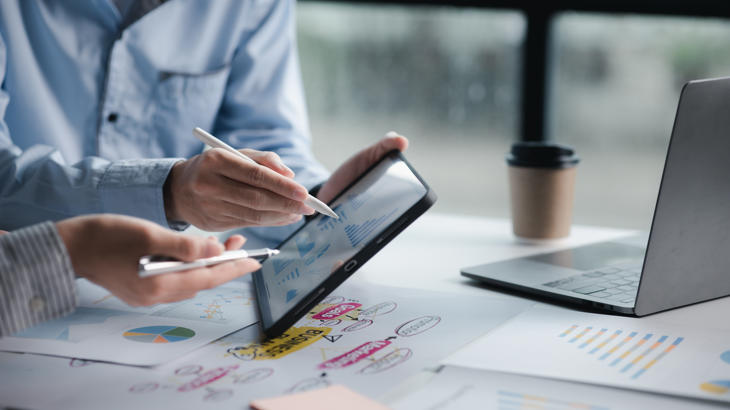 a person using a tablet and stylus