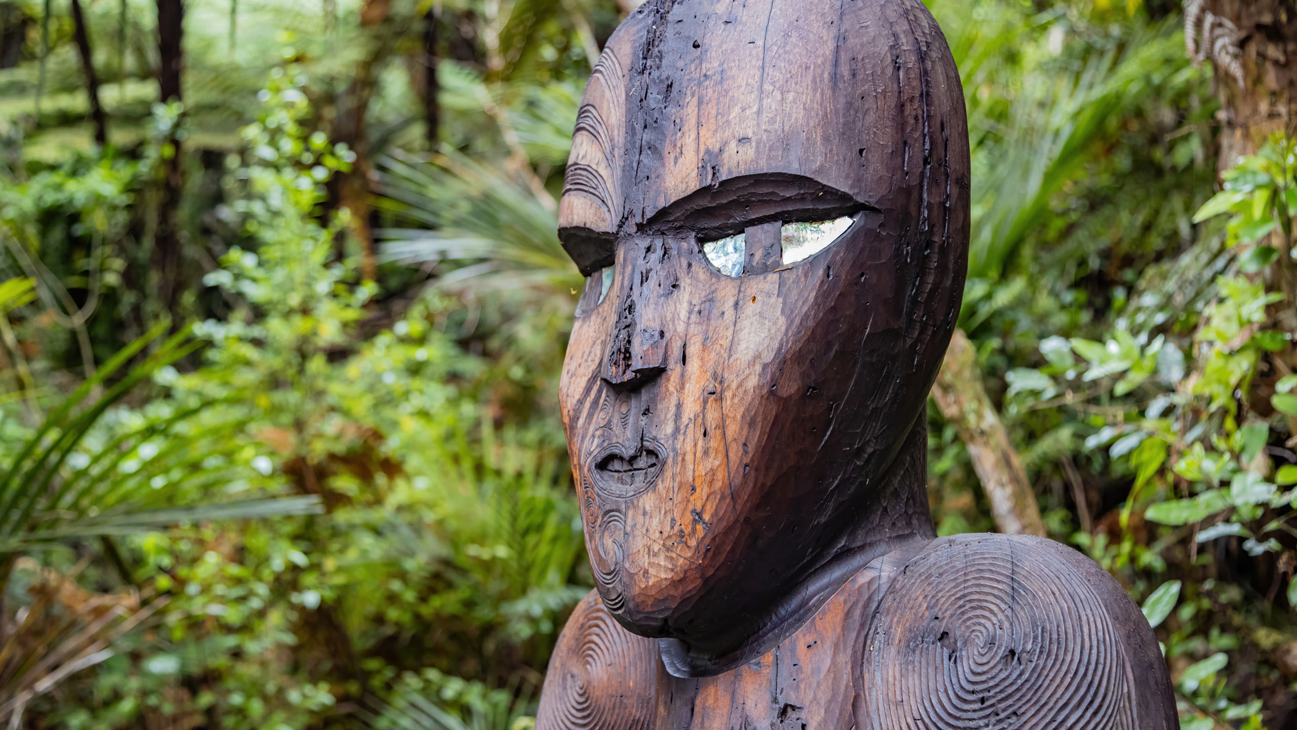 a wood carving of a person