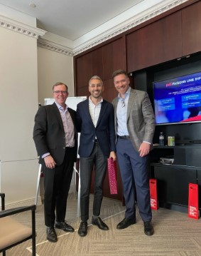 a group of men standing in a room