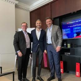 a group of men standing in a room