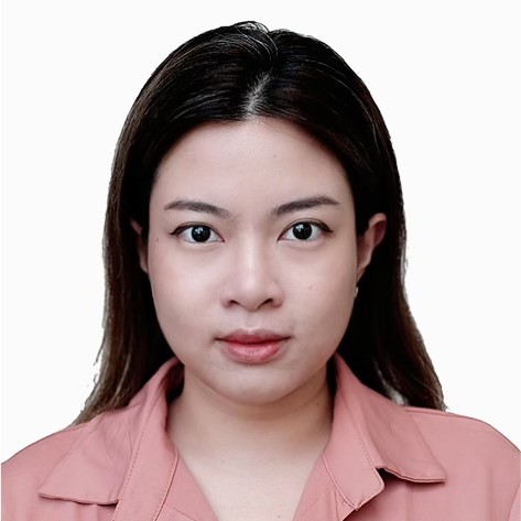 a person with long hair wearing a pink shirt