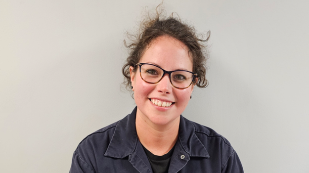 a person wearing glasses and a uniform