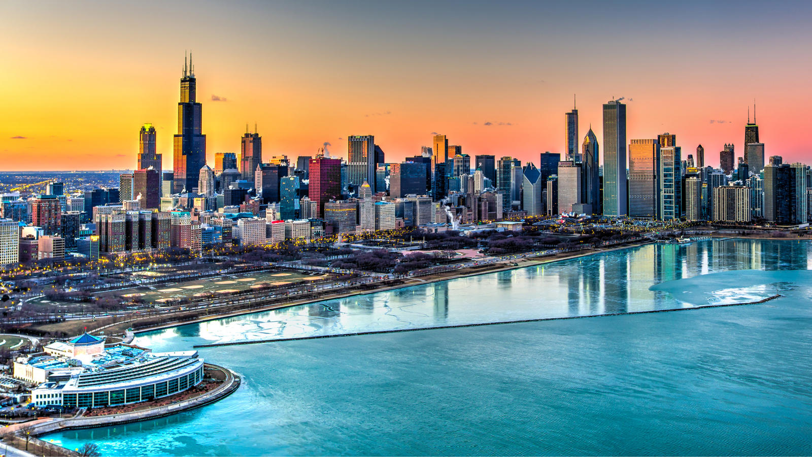 a city skyline with a body of water