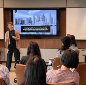 a person giving a presentation to a group of people