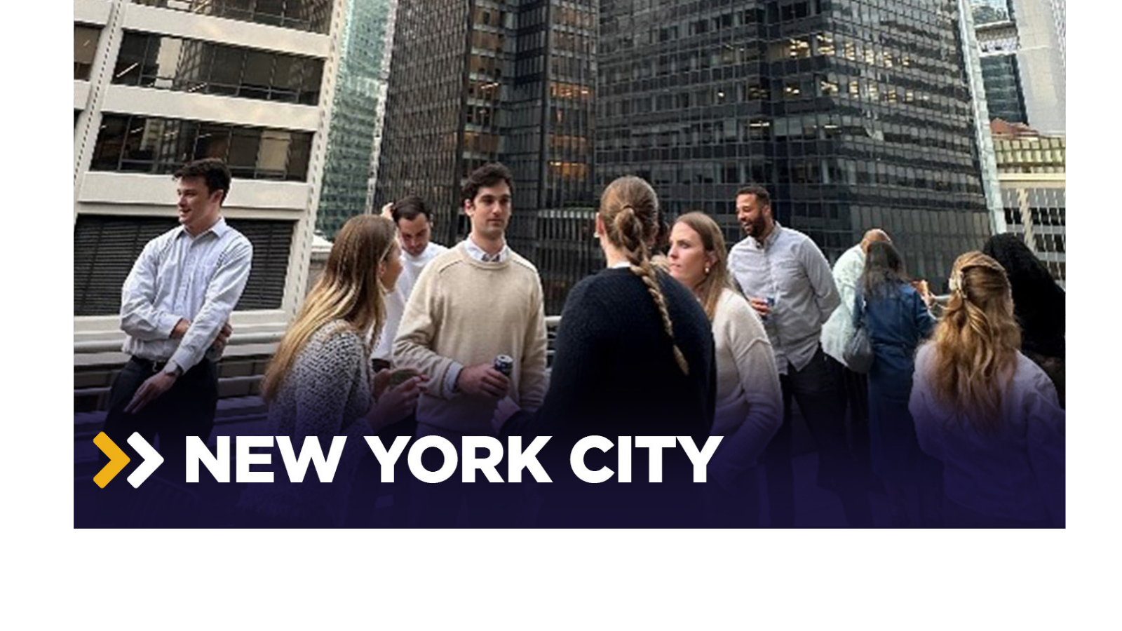 a group of people standing in a city