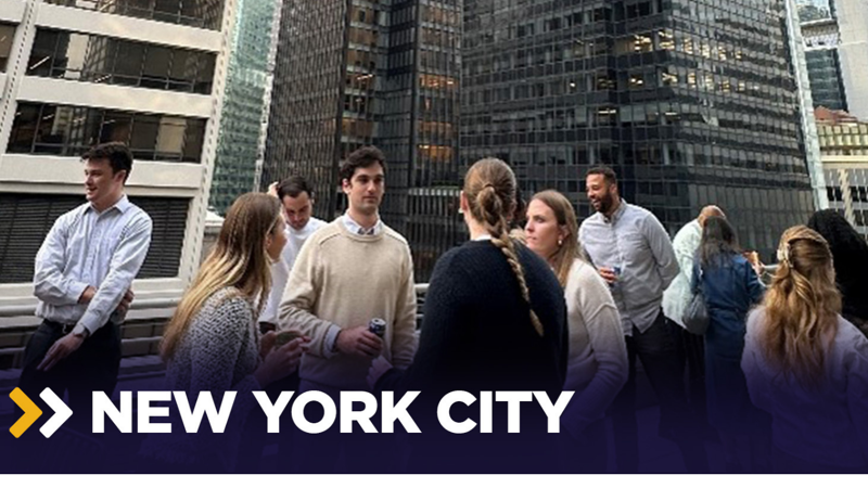 a group of people standing in a city
